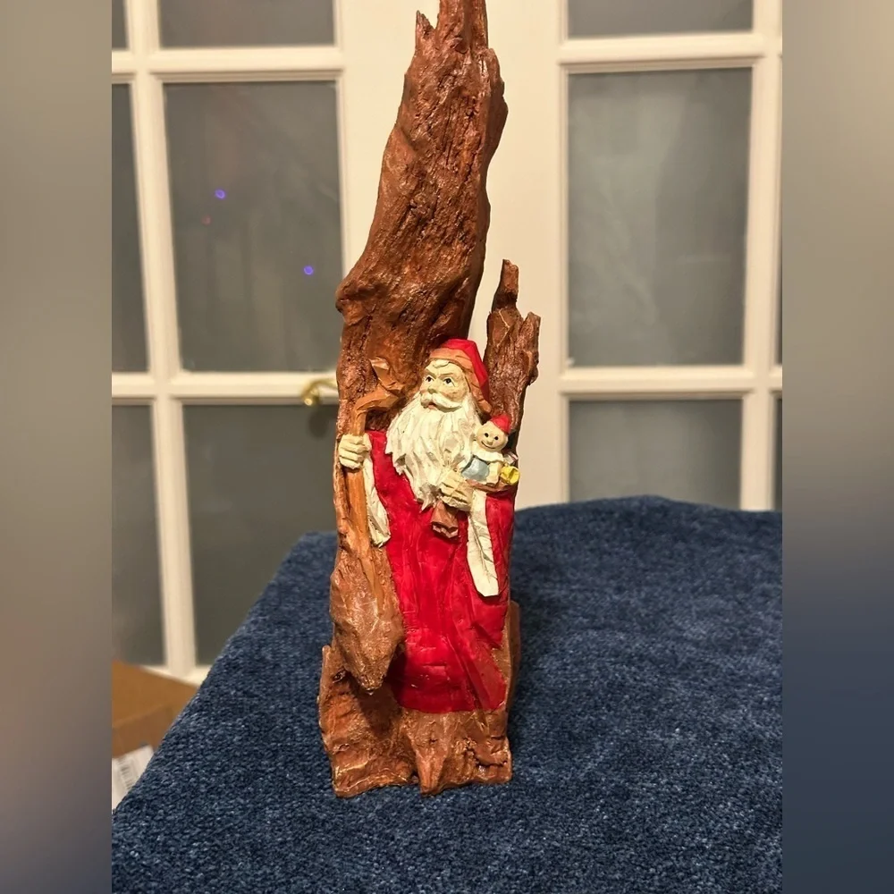 Intense resin Santa looks out from between the cliffs. Very different.